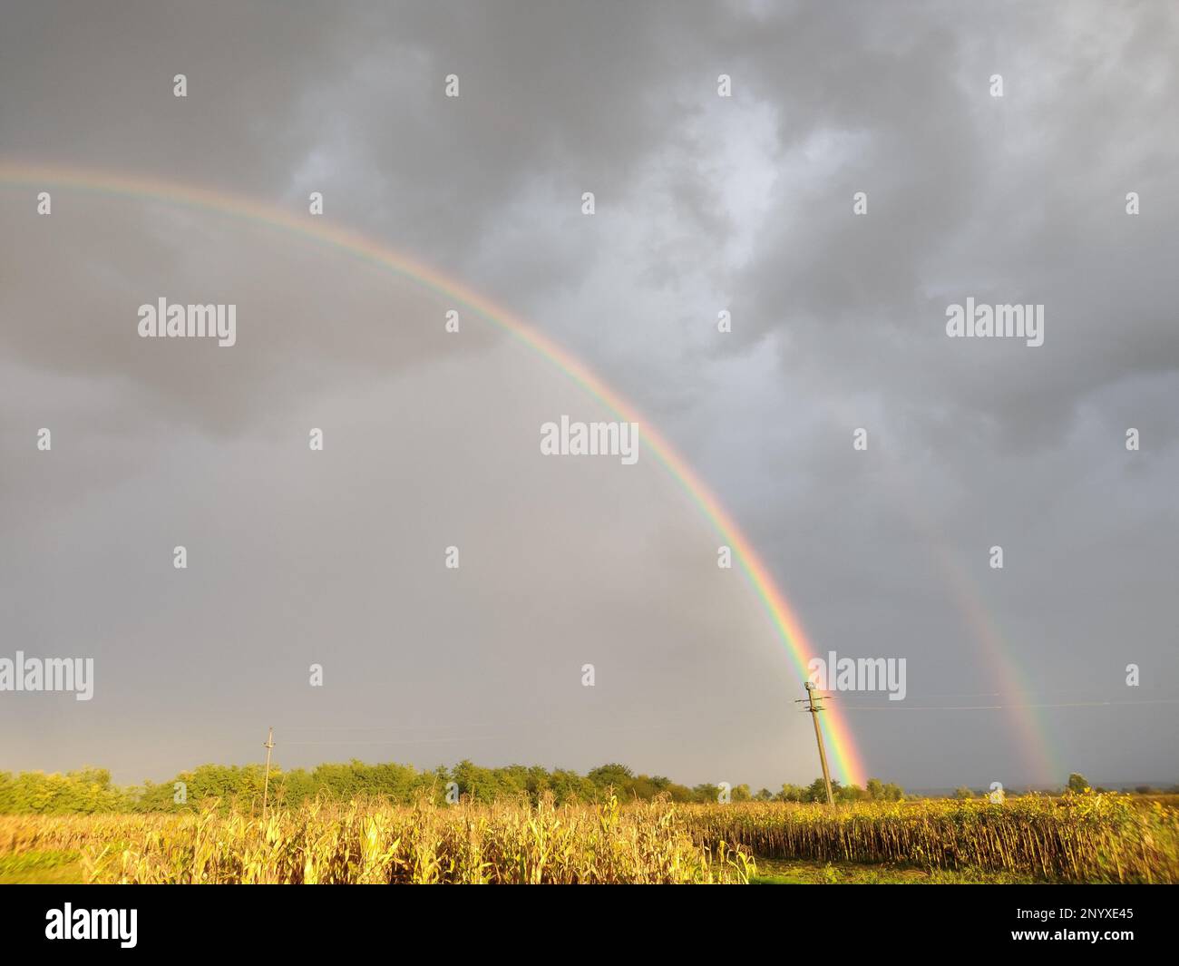 Natural rainbow after the rain in Maramures county, Romania Stock Photo ...