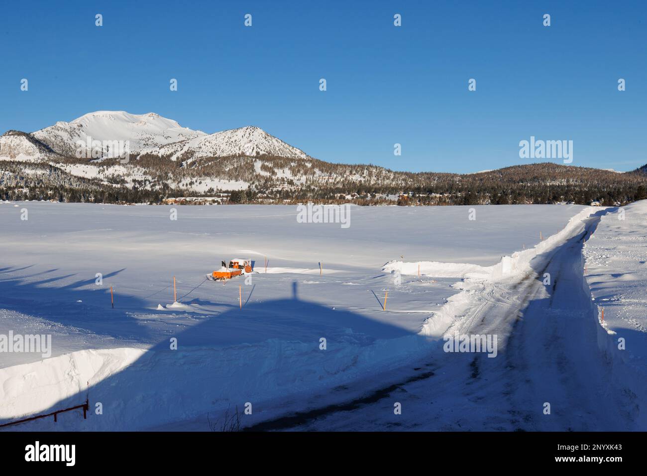Sherwin Creek road extends through snow fields towards the town of