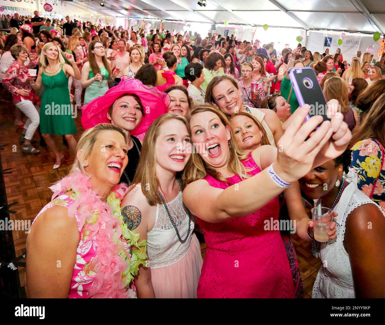 Crystal Rees takes a selfie with a group of friends during the Bloomers ...