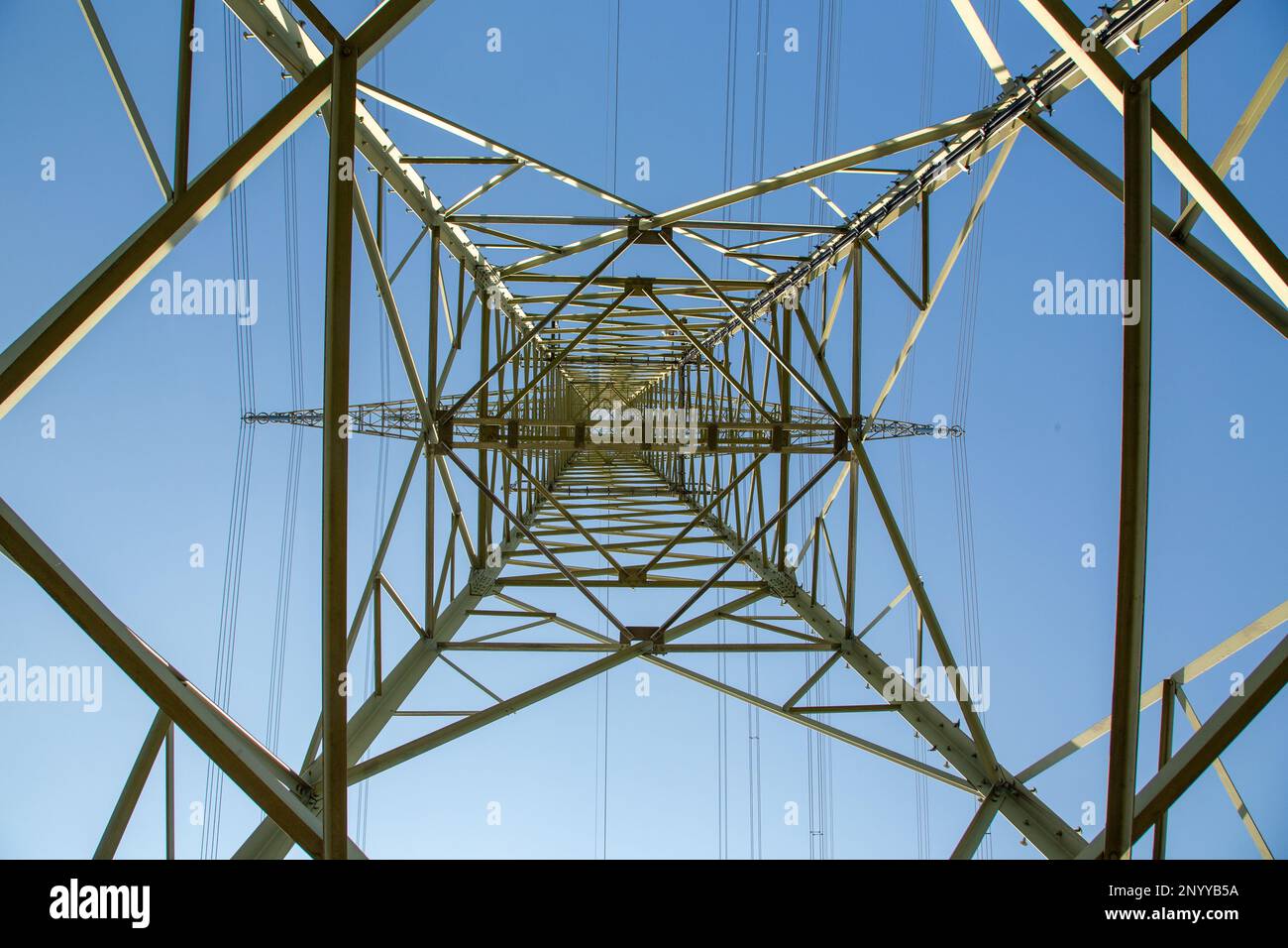 detail of electricity pylon under clear blue sky as energy symbol Stock ...