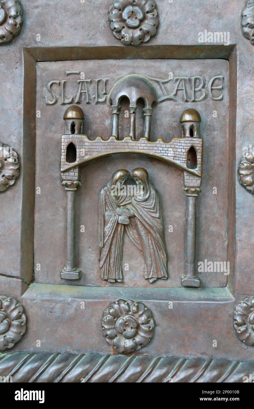 A fragment of the bronze entrance door of the world's largest Baptistery of San Giovanni in Pisa. Construction 1152-1363 Stock Photo