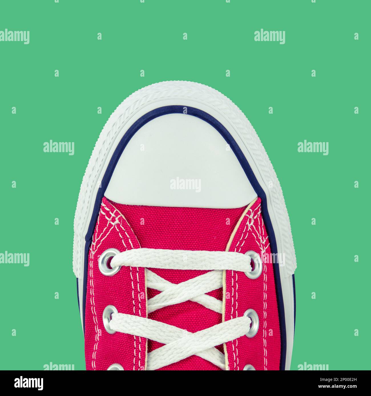 Retro Vintage Red Canvas Basketball Boots From Above On A Green Background Stock Photo