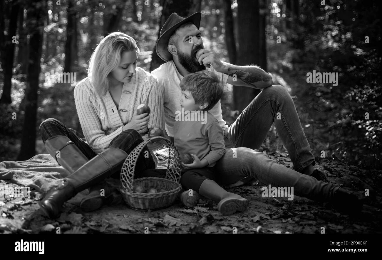 Happy family with kid boy relaxing while hiking in forest. Mother ...