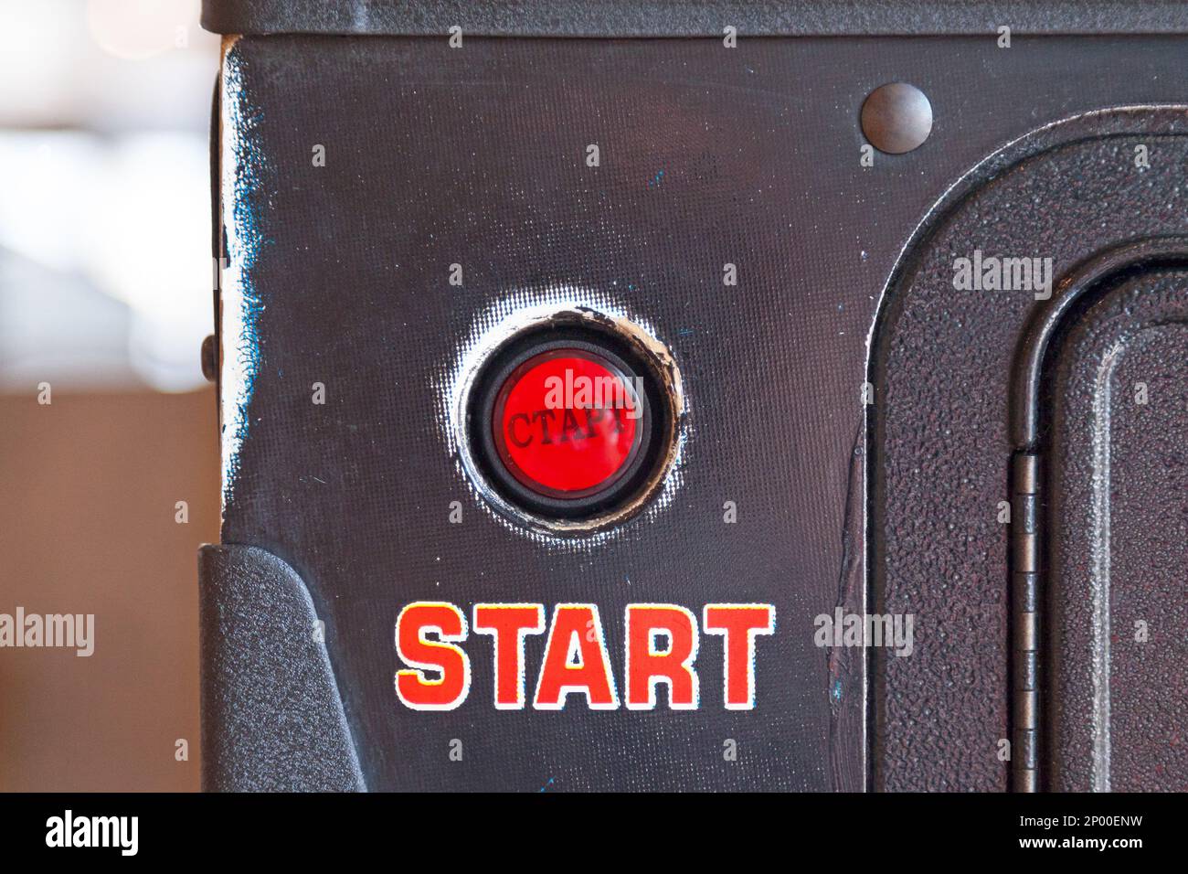 Close-up on a push start button of a vintage pinball machine. Stock Photo