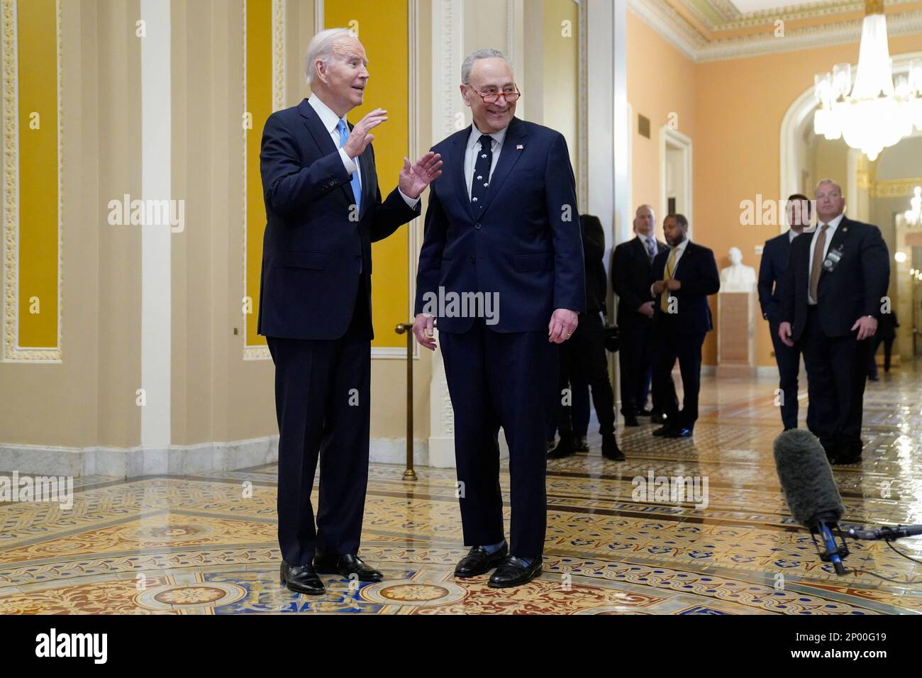 President Joe Biden stands with Senate Majority Leader Chuck Schumer of ...