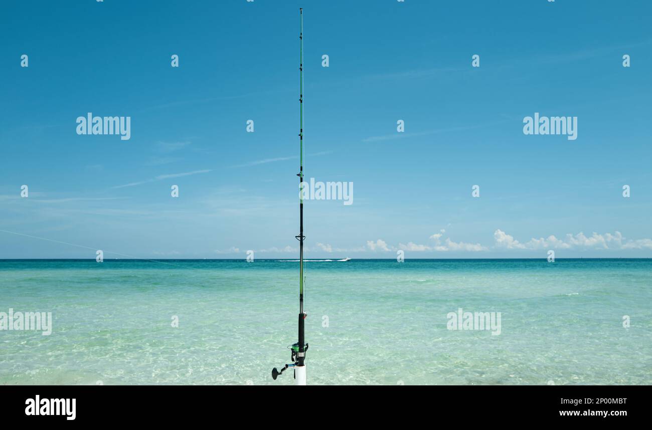 Fishing Sea and Summer vacation. Fishing rod, spinner, fish-rod. Relaxing  seascape Stock Photo - Alamy
