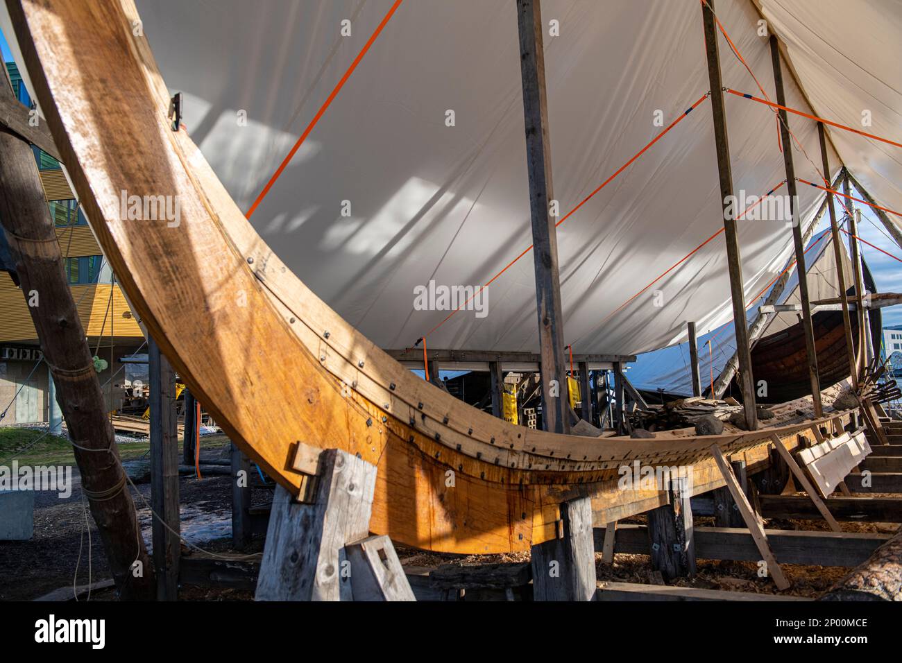 Replica Viking longboats under construction using traditional methods