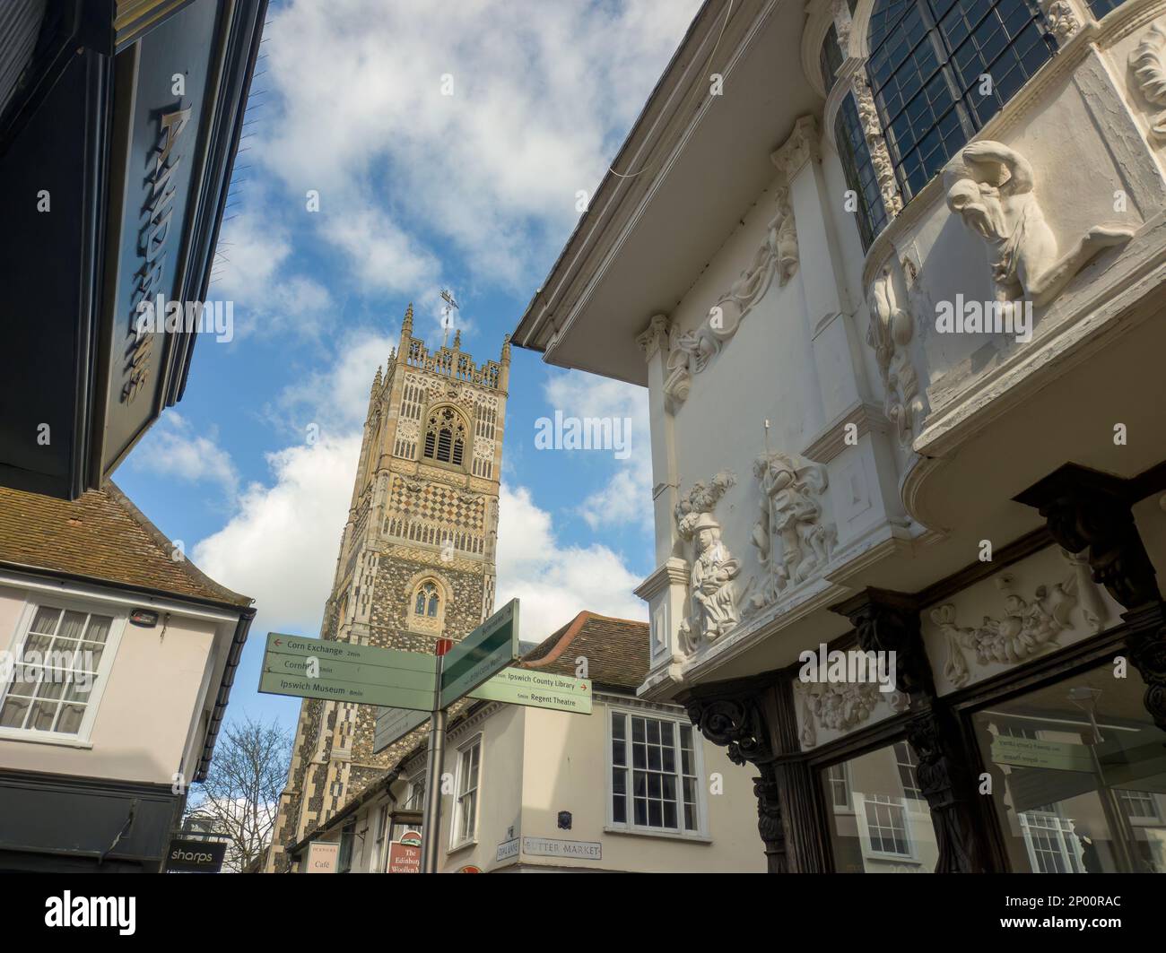 The tower of St Mary-le-Tower Church between the narrow streets of Ipswich, Suffolk, UK Stock Photo