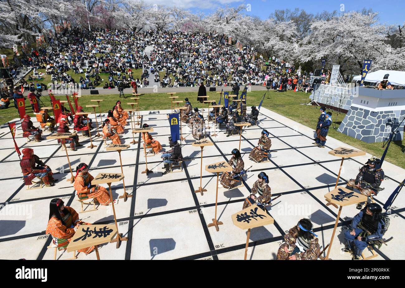 Local high school students perform Ningen Shogi, human Japanese chess on  top of Mt. Maizuru, in Tendo, Yamagata Prefecture on April 22, 2017. Tendo  is known for production of shogi koma,'' pieces