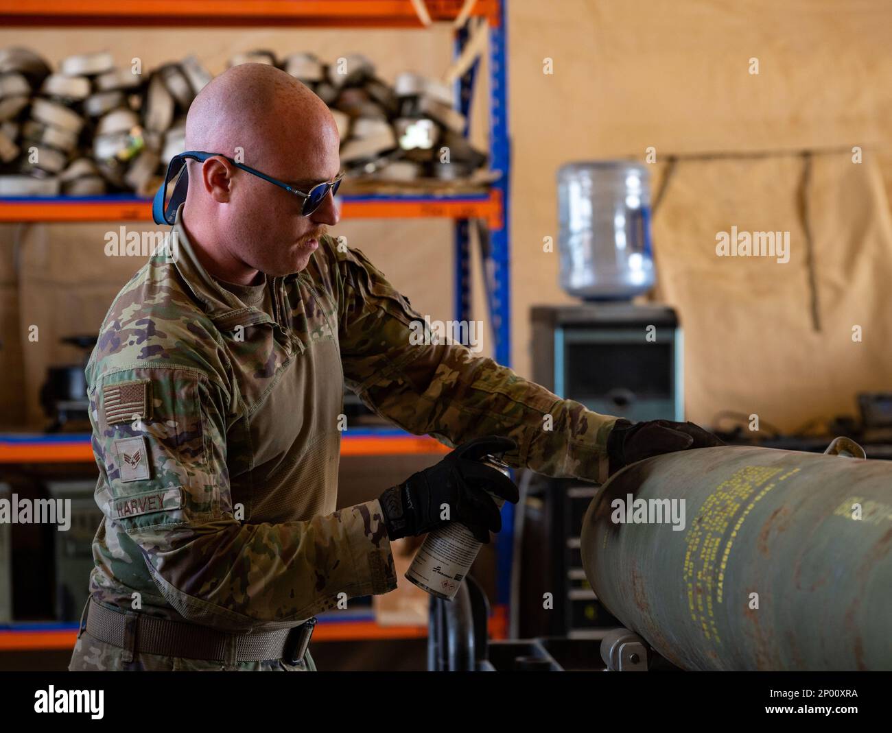 U.S. Air Force Senior Airman Timothy Harvey, assigned to the 378th Expeditionary Maintenance Squadron, disassembles a GBU-12 Paveway II inert bomb at Prince Sultan Air Base, Saudi Arabia, Feb. 15, 2023. The GBU-12 is an American aerial laser-guided bomb, with a nose-mounted laser seeker and fins for guidance. Stock Photo