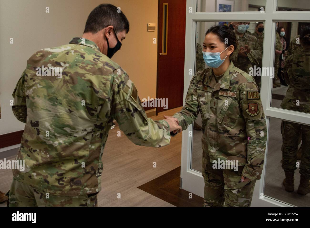 Maj. Gen. Andrew Gebara, 8th Air Force and Joint-Global Strike Operations Center commander, coins 2nd Lt. Serena Kim, 7th Healthcare Operations Squadron TRICARE operations and patient administration flight commander, during a base visit at Dyess Air Force Base, Texas, Jan. 6, 2023. Kim had identified discrepancies in the diagnosis paperwork to ensure children with autism get the care they need to receive. Stock Photo