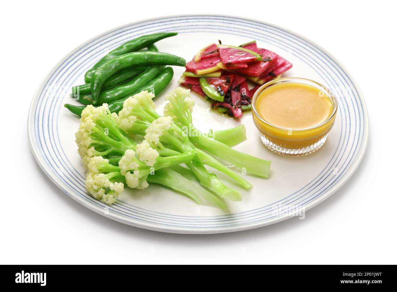 Three kinds of vegetable salad; baby stick cauliflower, watermelon radish, and snap peas Stock Photo