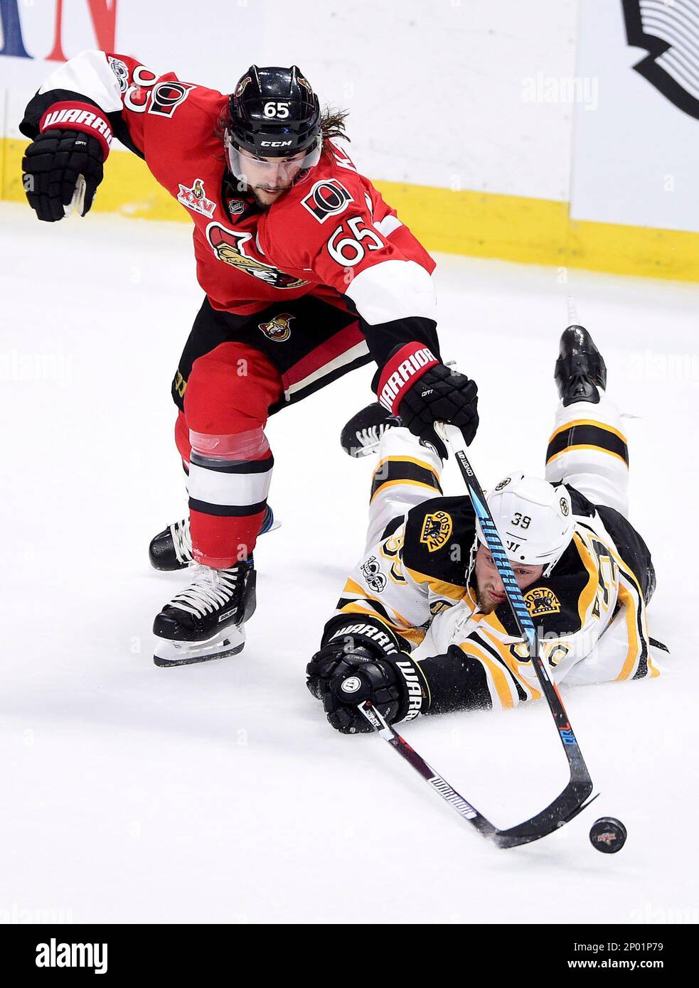 Ottawa Senators defenseman Erik Karlsson (65) and Boston Bruins left ...