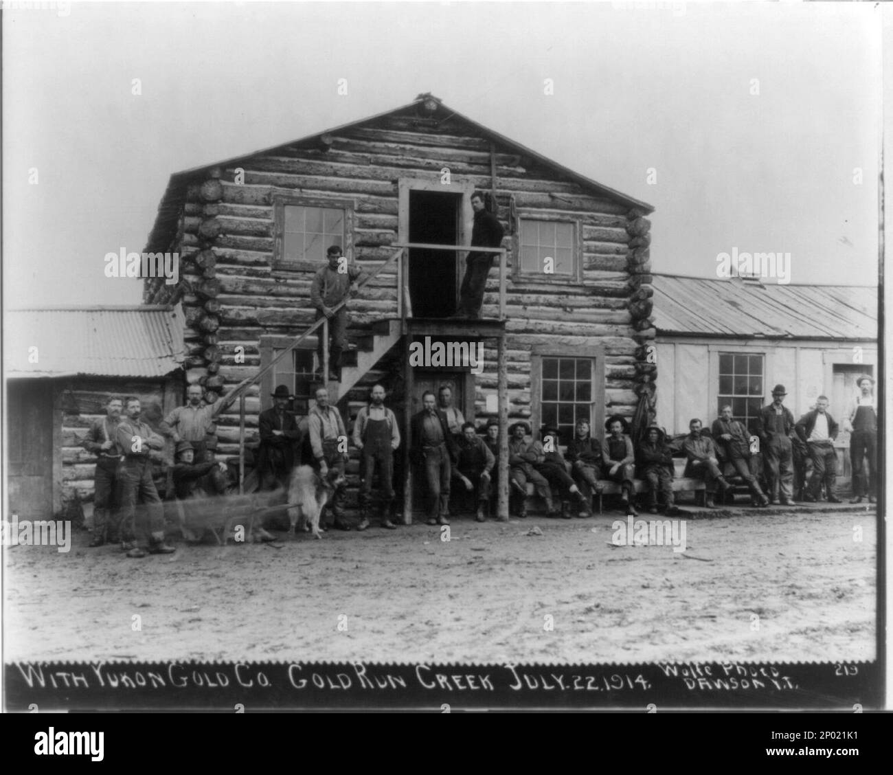 23 men posed outside Yukon Gold Co. Dawson, 1914. Title and other information transcribed from caption card and item, Frank and Frances Carpenter Collection , Caption card tracings: Alaska; Shelf. Stock Photo