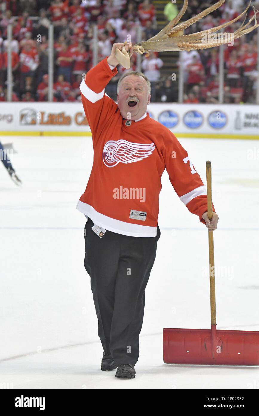 Joe Louis Arena building manager Al Sobotka swings the first