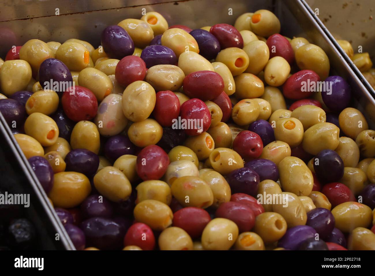 variety selection of marinated and pickled olives in a food stall for selling Stock Photo