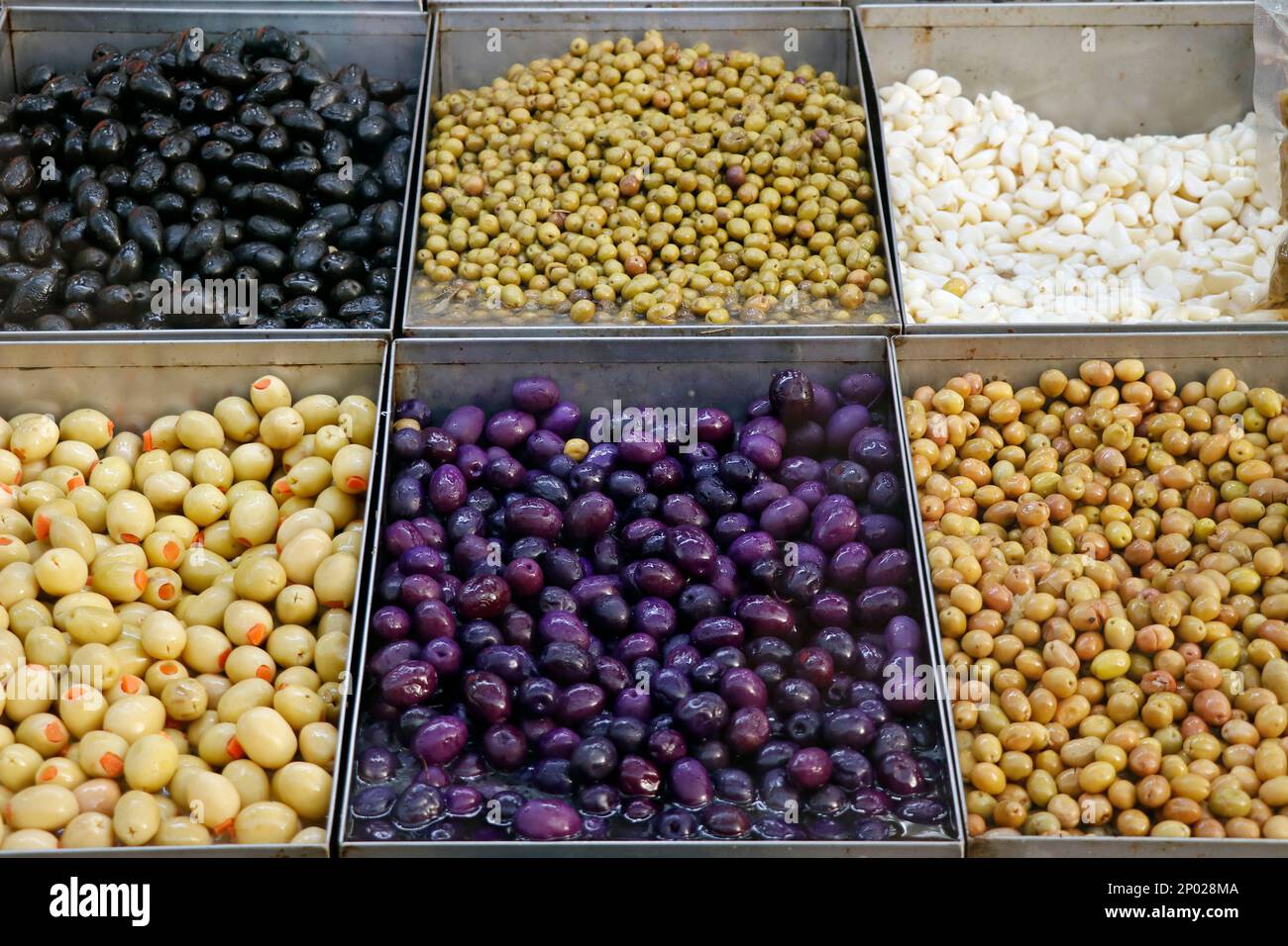 variety selection of marinated and pickled olives in a food stall for selling Stock Photo