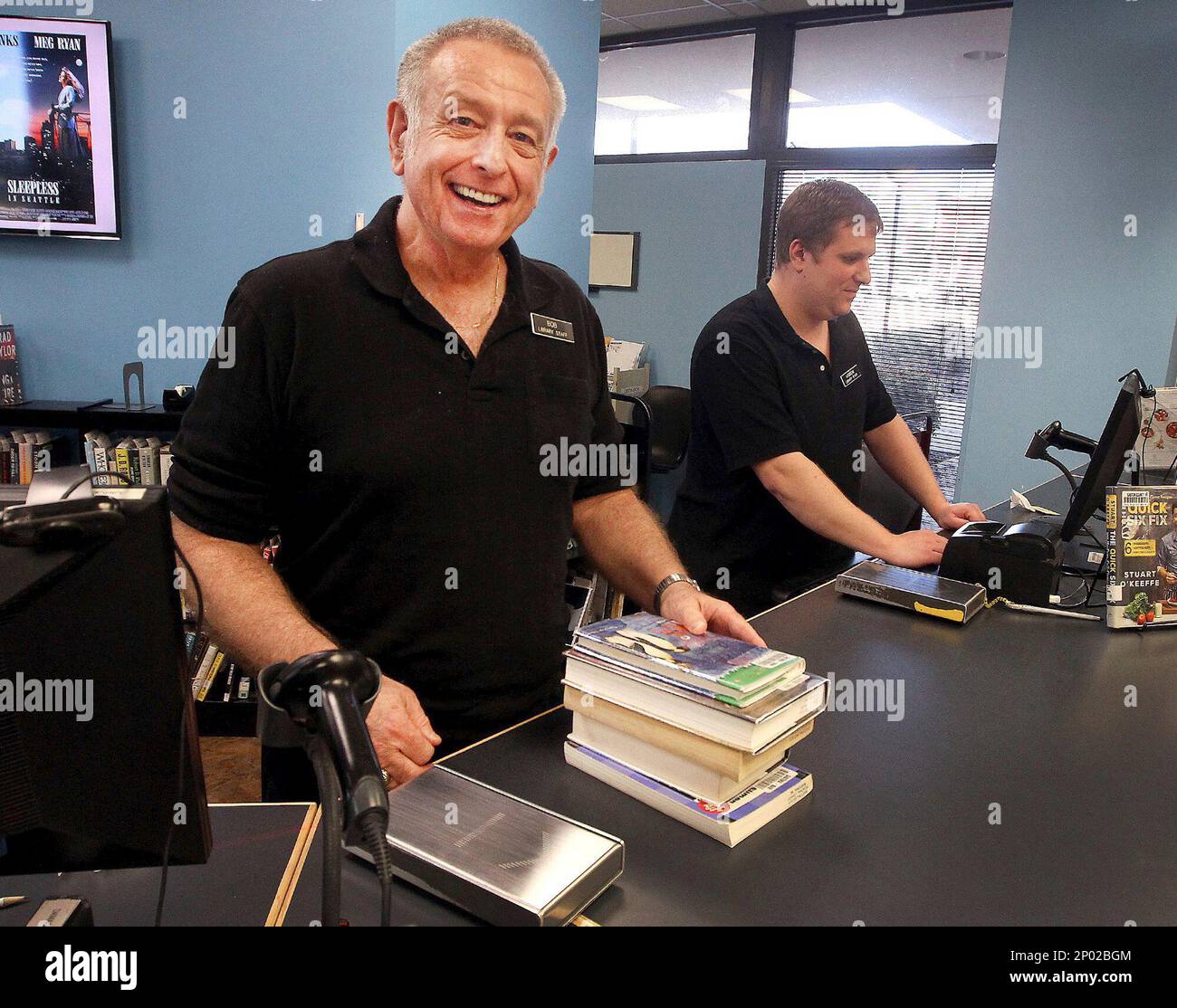 In this Jan. 24, 2017 photo, Bob Bigger mans the circulation desk at