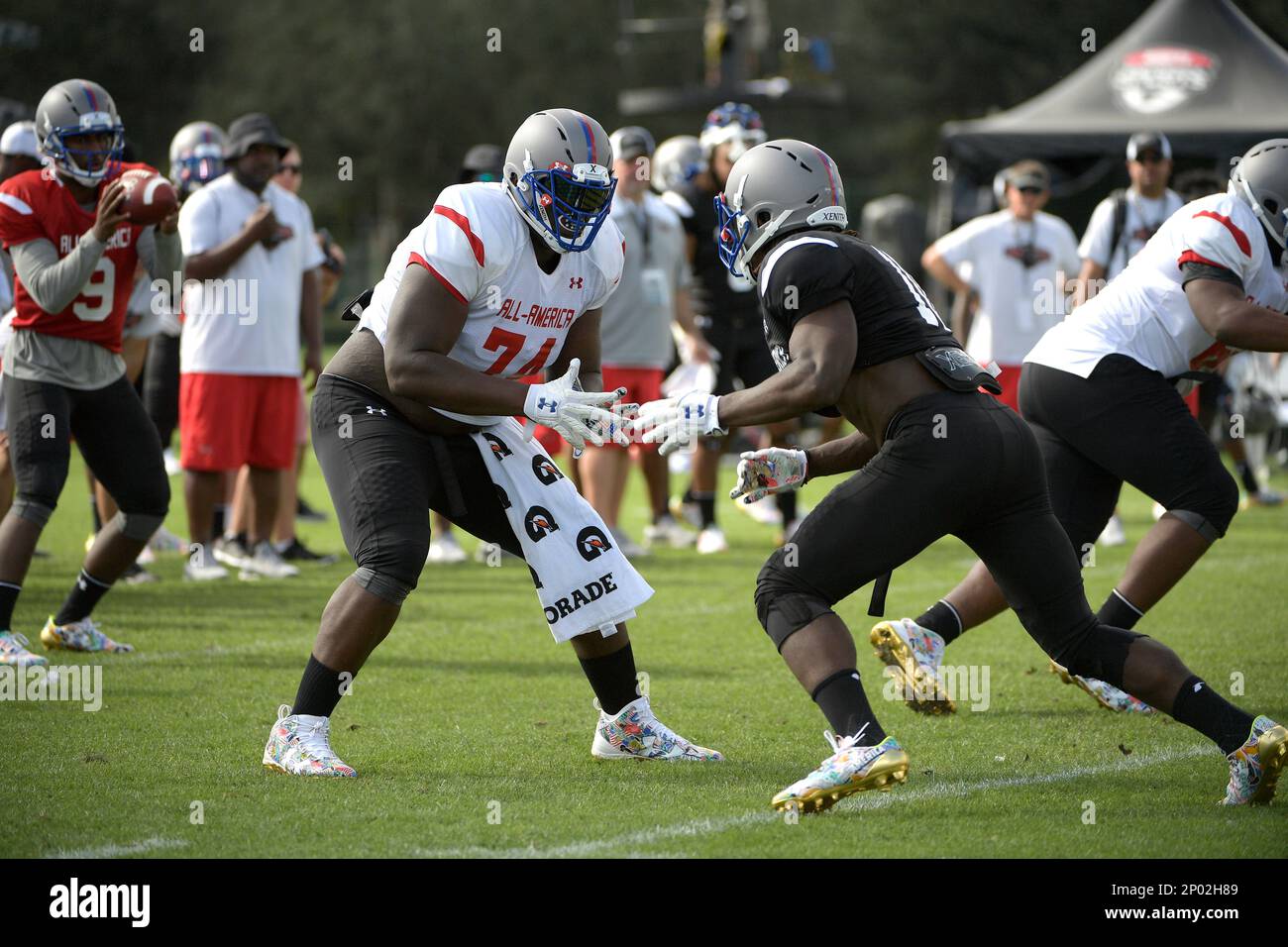 Team Armour offensive tackle Isaiah Wilson (74) works against defensive end  Luiji Vilain (10) during a practice for the Under Armour All-America  football game in Lake Buena Vista, Fla., Thursday, Dec. 29,