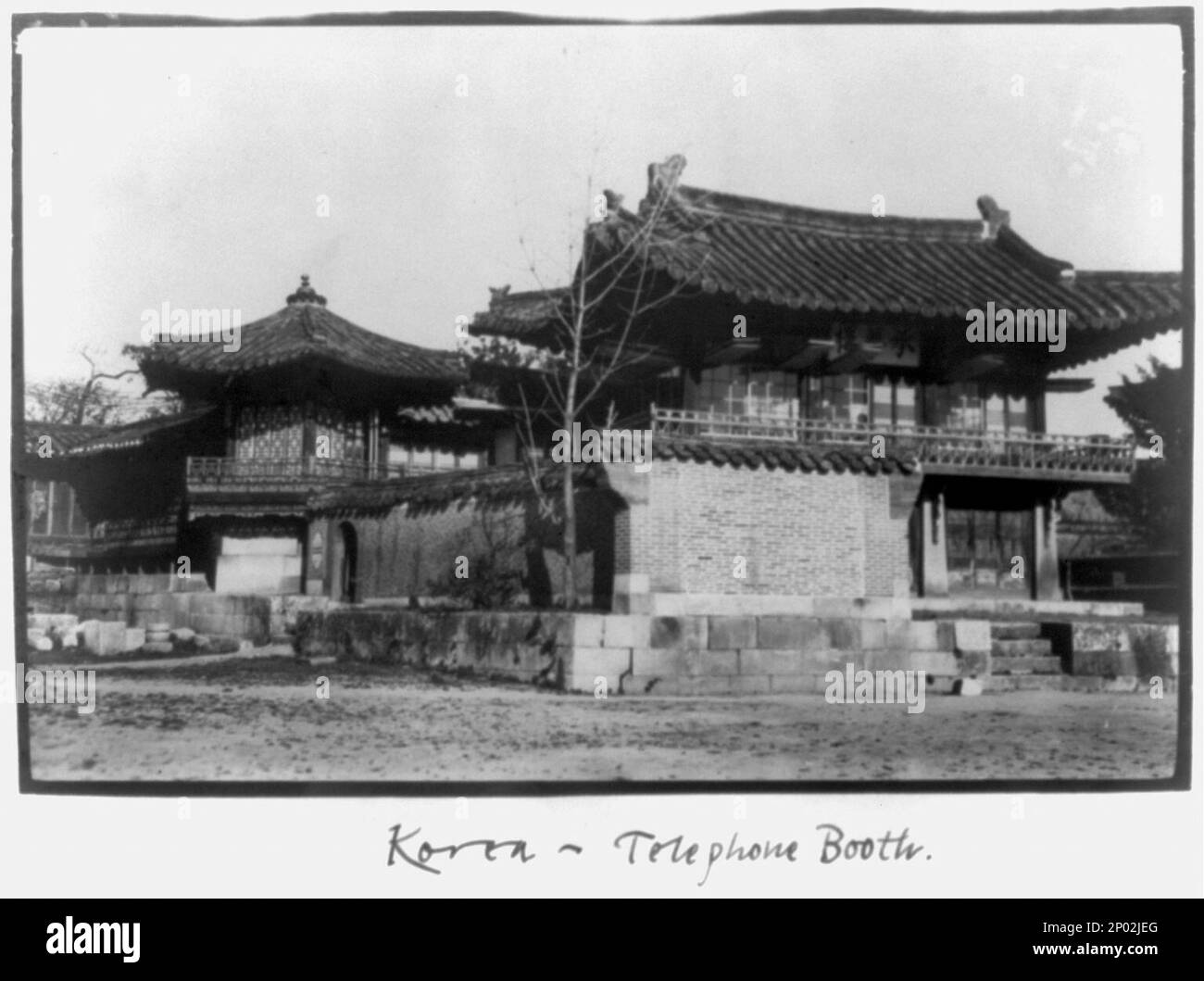 Korea - Seoul - telephone booth low brick building. Photoprint by Frank G. Carpenter, Title and other information transcribed from caption card and item, Frank and Frances Carpenter Collection , Caption card tracings: Geog.; Telephones. Stock Photo