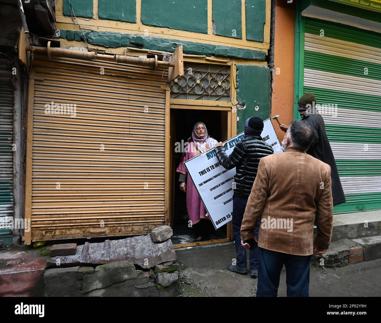 Srinagar, India. 02nd Mar, 2023. SRINAGAR, INDIA - MARCH 2: Officials from National Investigation Agency (NIA) place a notice of attachment on the property of Al-Umar Chief Mushtaq Zargar alias Latram at Gani Mohalla in downtown Nowhatta area on March 2, 2023 in Srinagar, India.(Photo By Waseem Andrabi/Hindustan Times/Sipa USA) Credit: Sipa USA/Alamy Live News Stock Photo