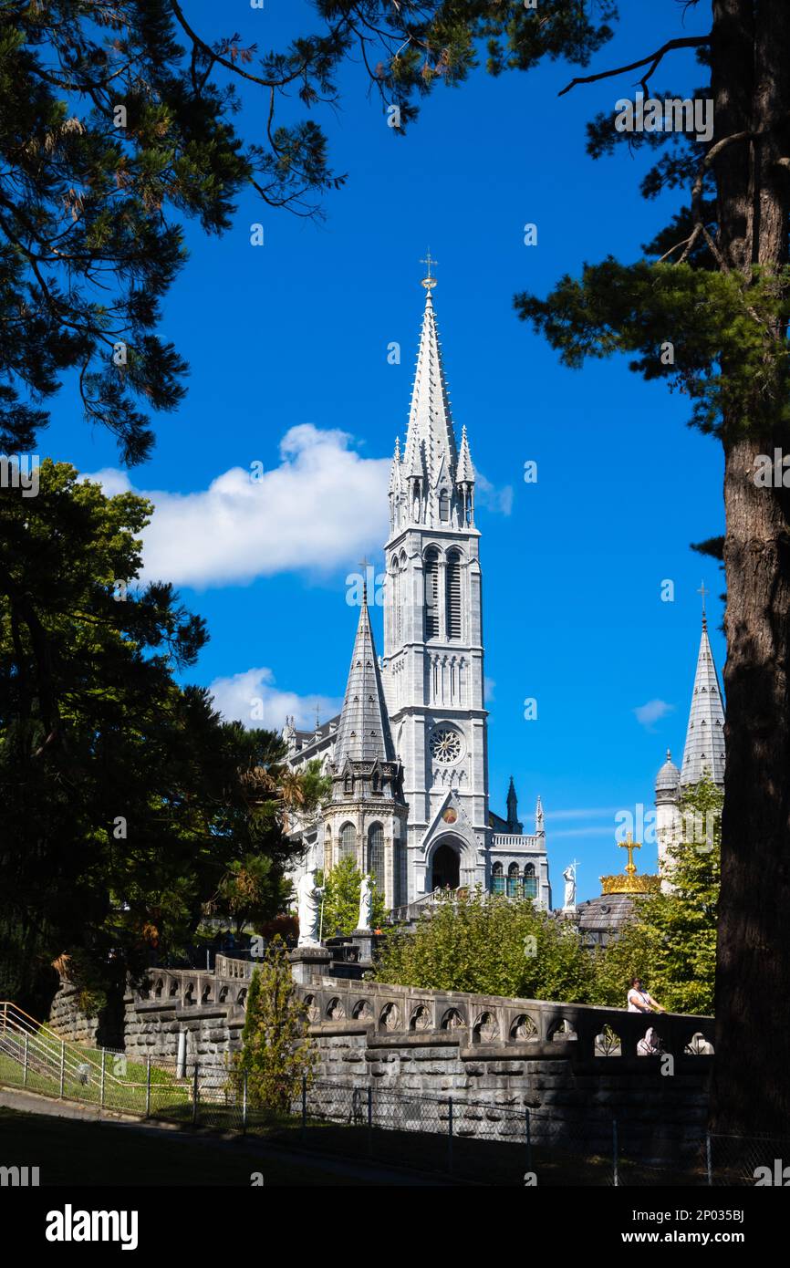 Pilgrimage basilica of Holy Rosary above the grotto in Lourdes Stock Photo