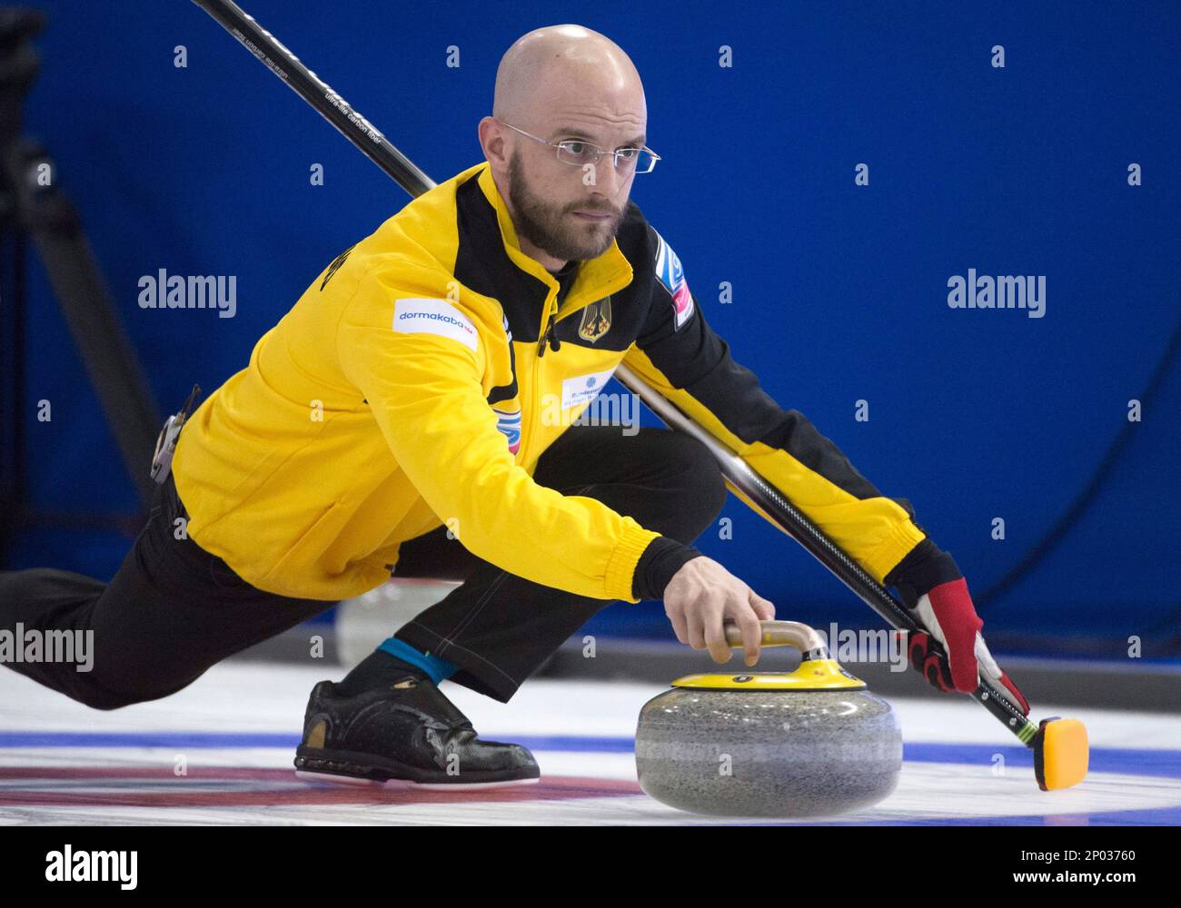 German skip Alexander Baumann makes a shot during a draw against the Netherlands at the mens World Curling Championships in Edmonton, Alberta, Saturday, April 1, 2017