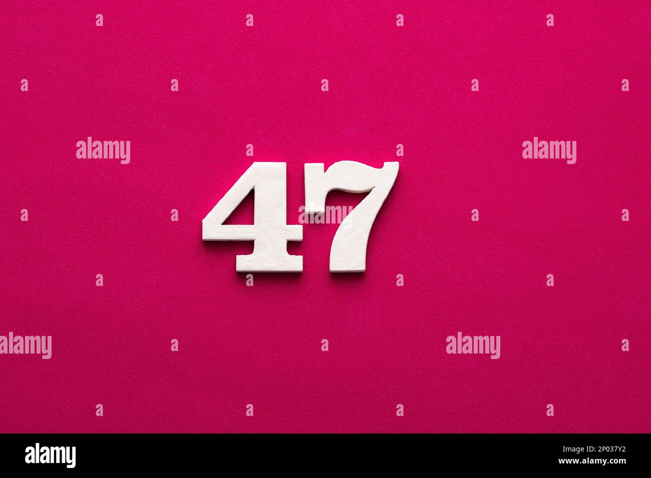Number 47 - white number in wood on rhodamine red background Stock ...