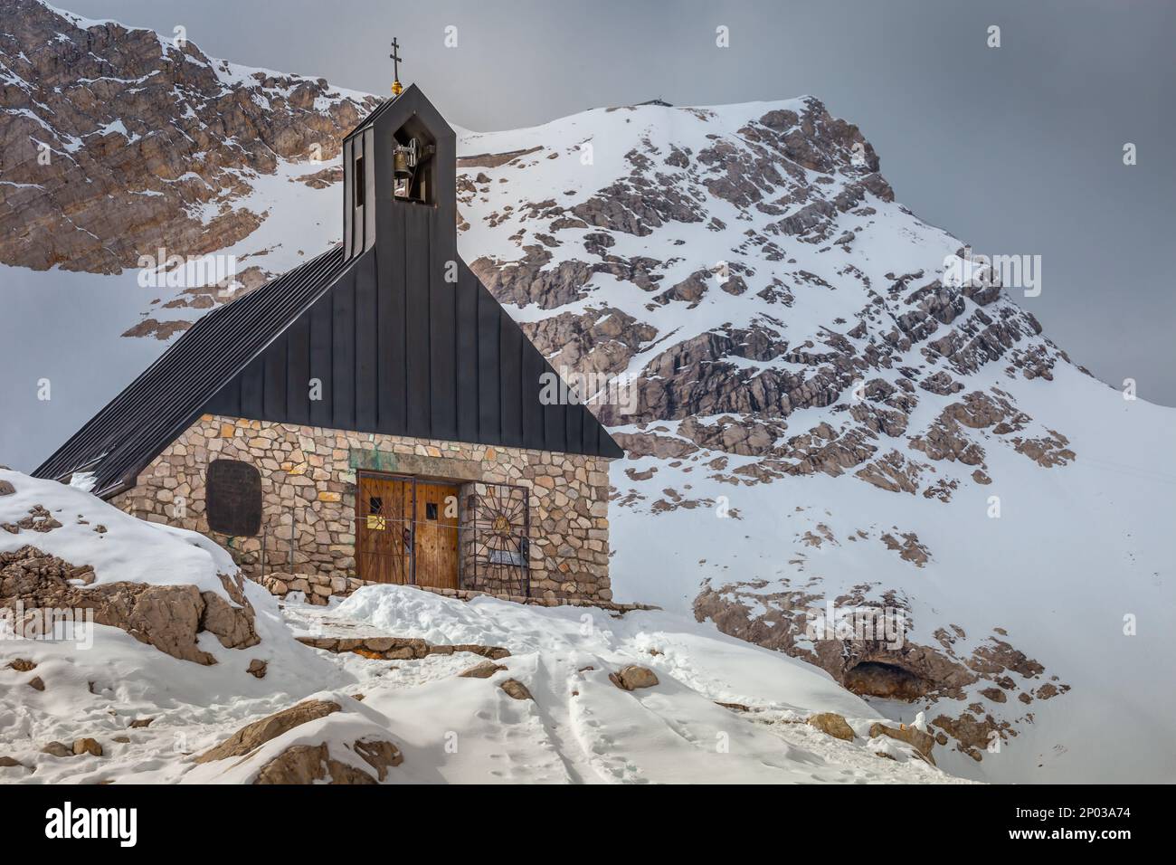 Church chapel and snowcapped Zugspitze, Garmisch Partenkirchen, Bavarian alps in Germany Stock Photo