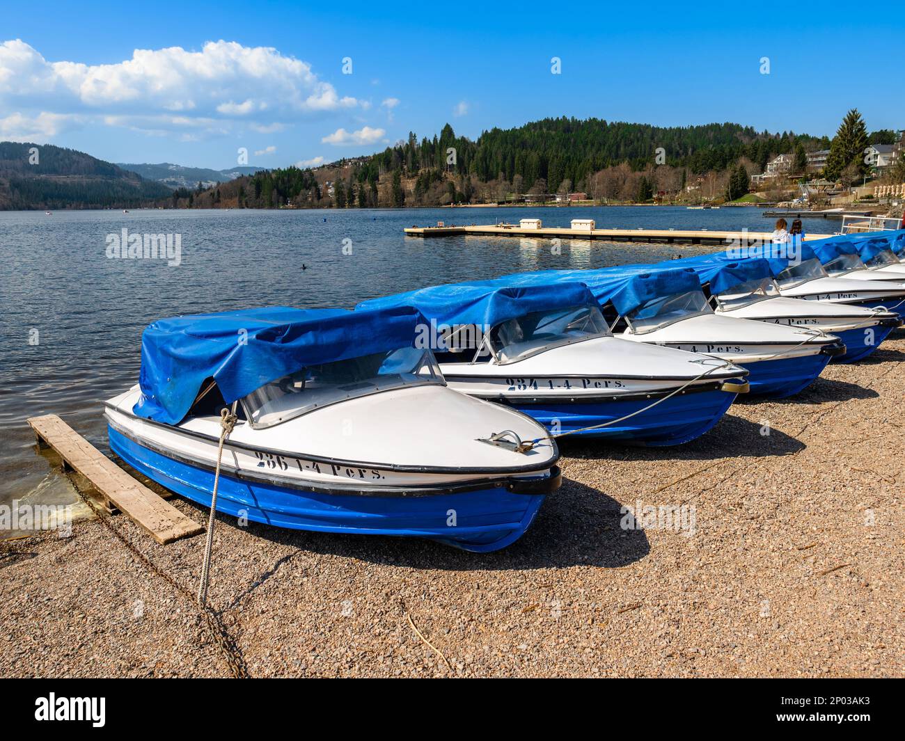 Neustadt, Germany - April 14, 2022: The tourist boats on the shore of Titisee lake in Neustadt, the Black Forest. Stock Photo
