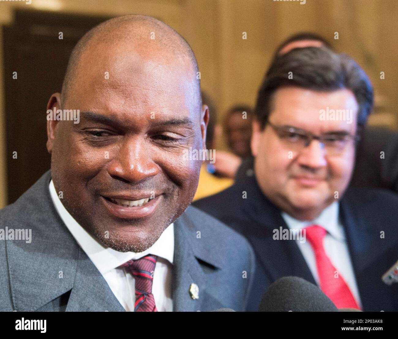 Former Montreal Expos great and Hall of Fame inductee Tim Raines, left,  speaks to the media as Mayor Denis Coderre looks on after a ceremony in his  honor at City Hall Friday