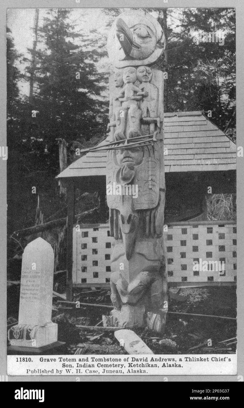 Grave totem and tombstone of David Andrews , Grave totem and tombstone of David Andrews, a Thlinket chief's son, Indian cemetery, Ketchikan, Alaska. Frank and Frances Carpenter collection , Gift; Mrs. W. Chapin Huntington; 1951, Tlingit Indians,Structures,Alaska,Ketchikan,1890-1940, Indians of North America,Structures,Alaska,Ketchikan,1890-1940, Totem poles,Alaska,Ketchikan,1890-1940, Tombs & sepulchral monuments,Alaska,Ketchikan,1890-1940, Cemeteries,Alaska,Ketchikan,1890-1940, United States,Alaska,Ketchikan Stock Photo