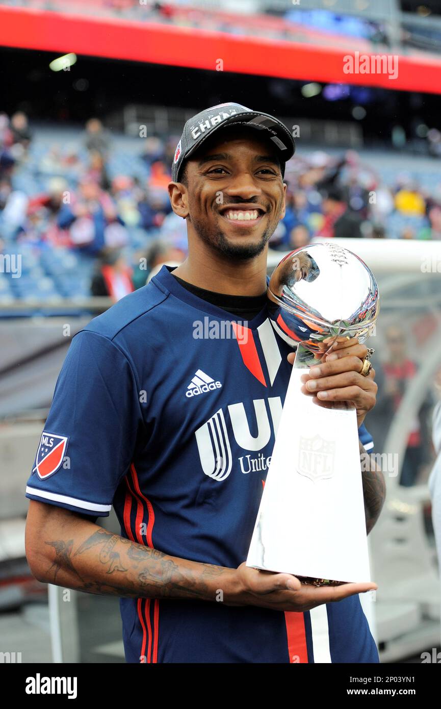 Saturday, March 25, 2017: New England Patriots wide receiver Malcolm  Mitchell (19) wears a New England Revolution jersey while waiting to  present the Lombardi Trophy from Super Bowl LI to New England