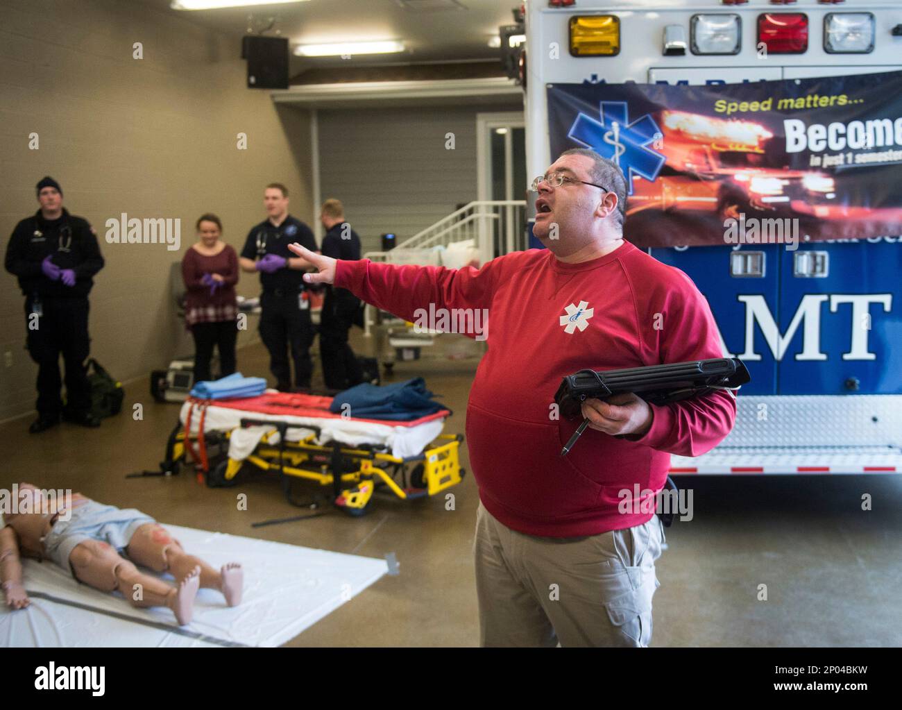 ICC EMS professor James Bender outlines the rescue process as more than 200  high school students from across the area get a chance to participate in  various procedures and rescues during Illinois