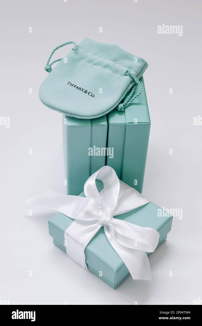 Tiffany boxes side by side, one Tiffany box with a silk ribbon and