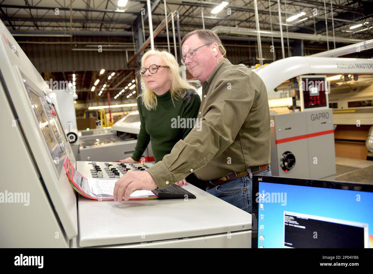 Packrite coowners Michael Drummond and his wife, Mary Drummond, stand