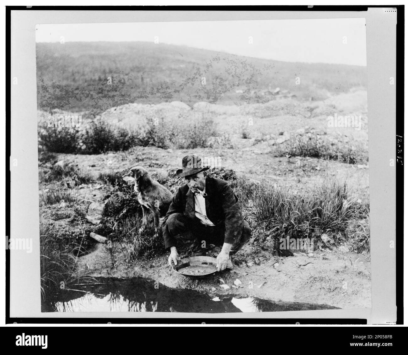 Gold miner panning Black and White Stock Photos & Images Alamy