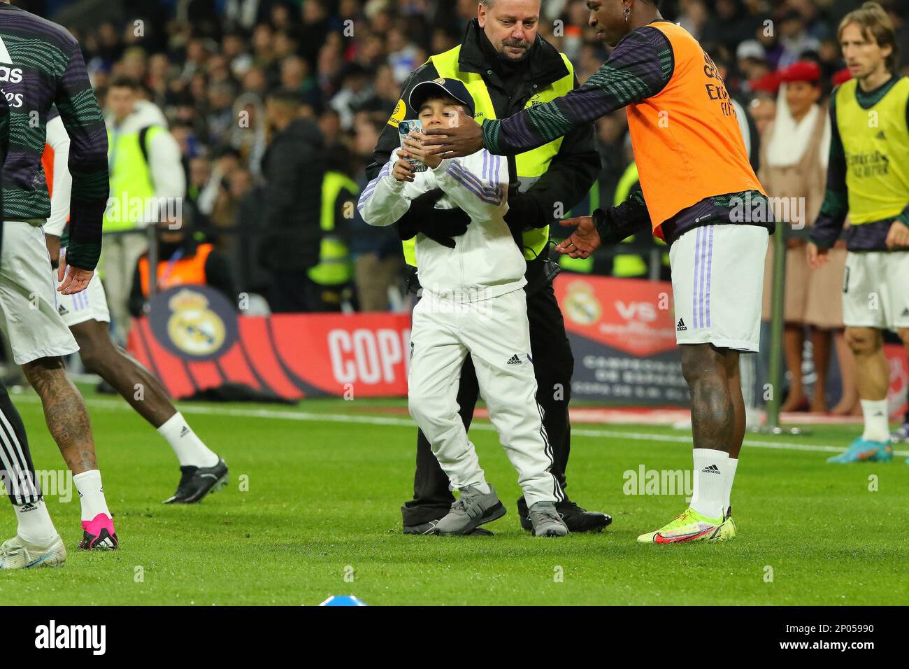 Madrid, Spain. 01st Mar, 2023. Young fan jumps on pitch for a selfie during Copa del Rey Semifinal Match between Real Madrid and FC Barcelona at Santiago Bernabeu Stadium in Madrid, Spain, on March 2, 2023. (Photo by Edward F. Peters/Sipa USA) Credit: Sipa USA/Alamy Live News Stock Photo