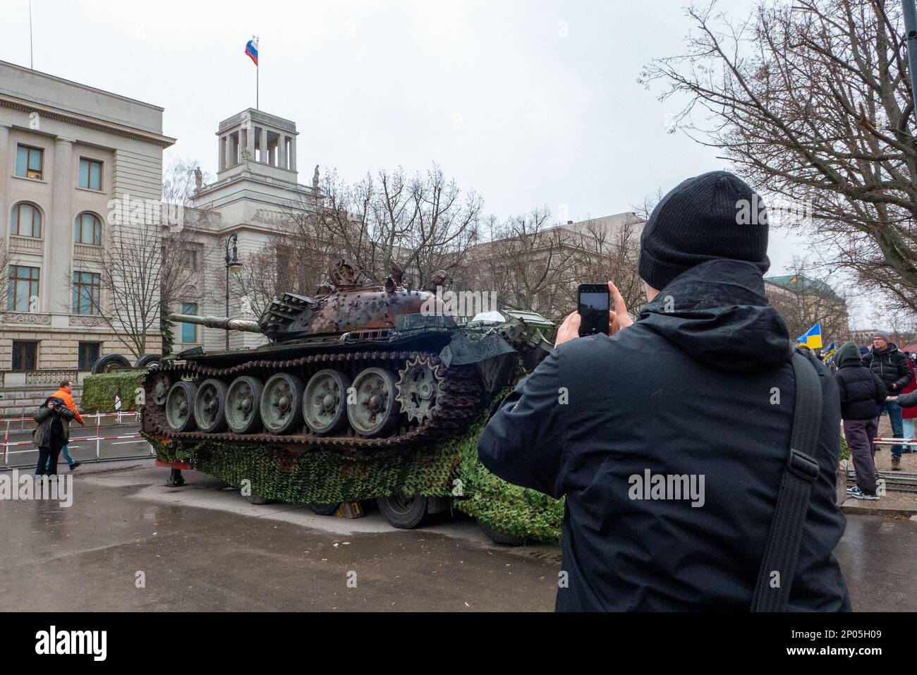 As a protest against the Russian attack on Ukraine activists placed a destroyed Russian army T-72 tank in front of the Russian embassy in Berlin. Stock Photo