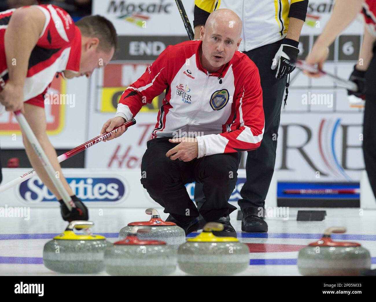 Team Canada skip Kevin Koe watches a rock as they play Manitoba in draw 20 semifinal action at the Tim Hortons Brier curling championship at Mile One Centre in St