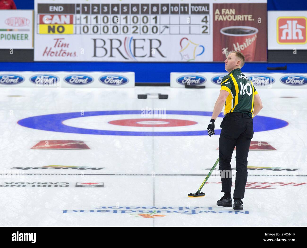 Northern Ontario skip Brad Jacobs looks at the replay on the overhead screen on his last shot in 3 vs
