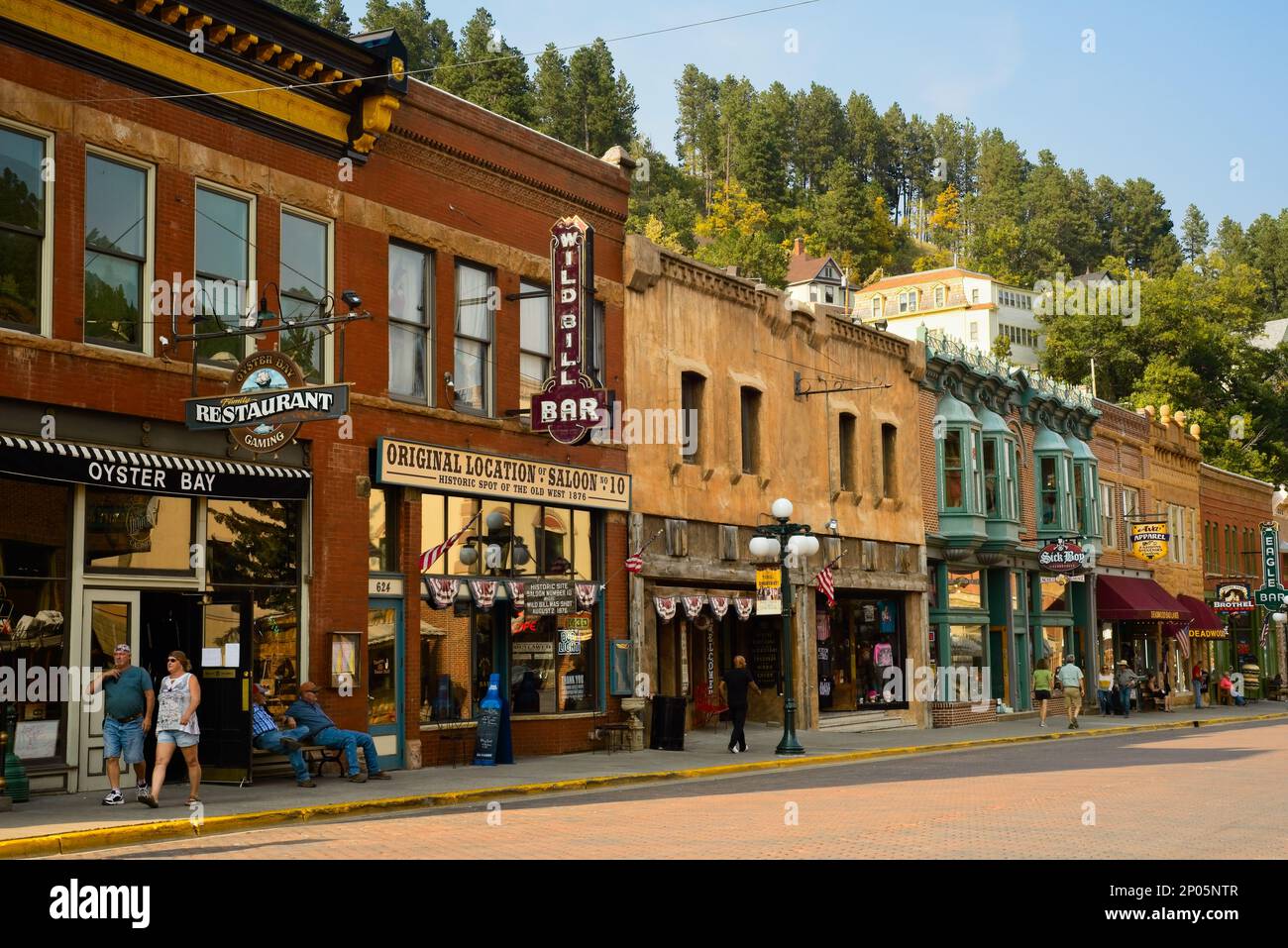 Historic saloons, bars, and other attractions bring visitors to historic Main St. in the Black Hills gold rush town of Deadwood, South Dakota. Stock Photo