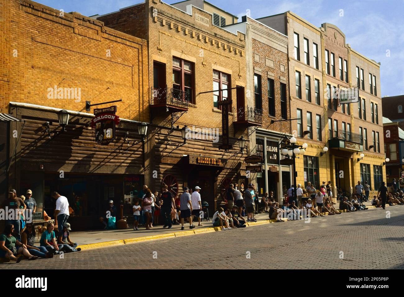 Even during the Covid pandemic, visitors line up for dinner outside Saloon No. 10 on historic Main St. in Deadwood, South Dakota. Stock Photo