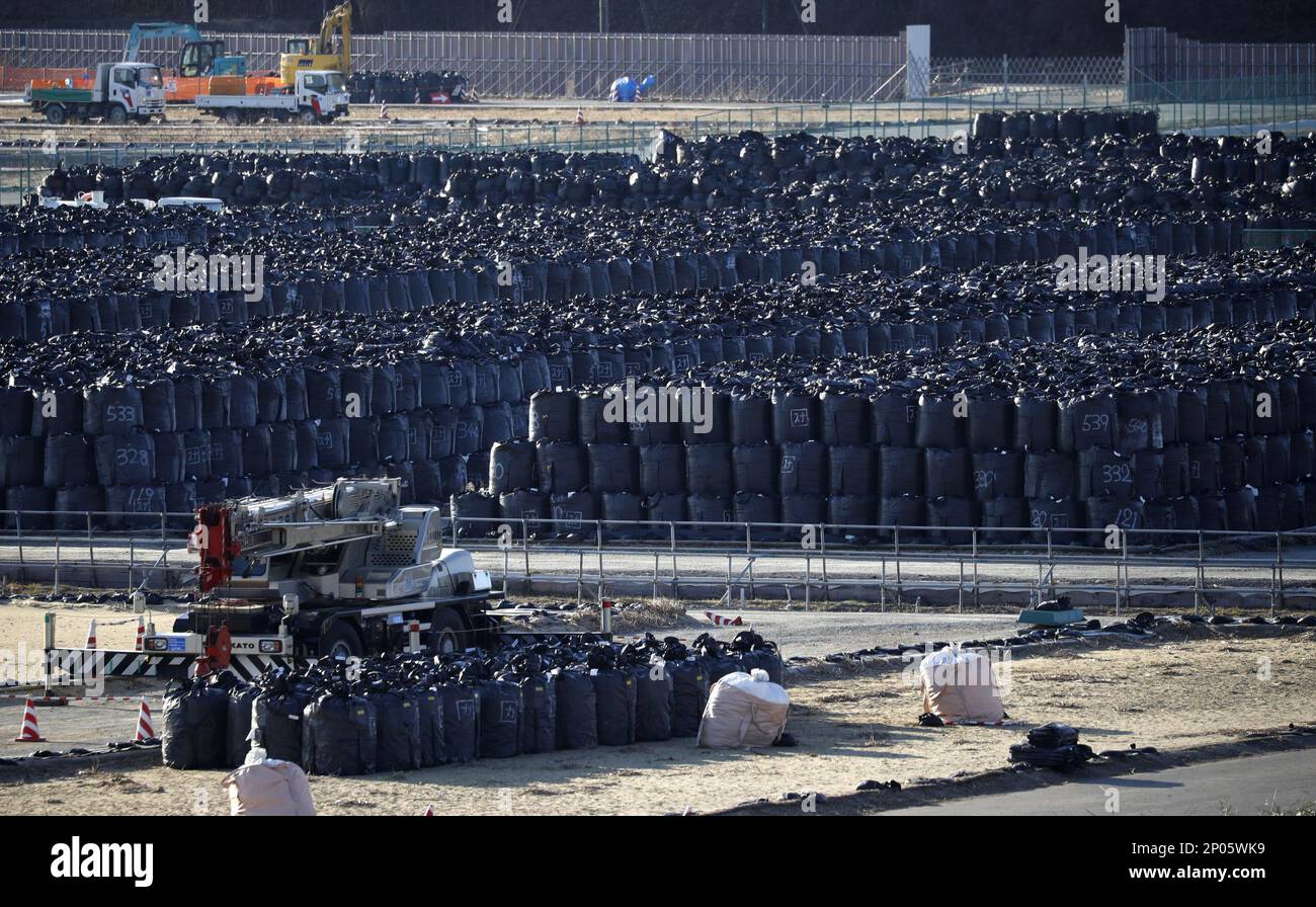 Black garbage bags filled with radioactivity waste are kept temporally