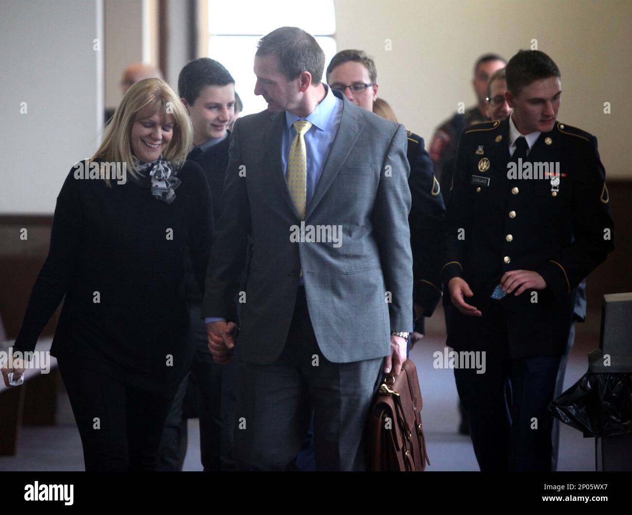 FILE In this March 6, 2017 file photo, Curtis Lovelace, center, walks