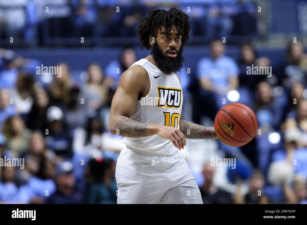 KINGSTON, RI - FEBRUARY 25: VCU Rams guard Jonathan Williams (10) with the  ball during the second half of a college basketball game between VCU Rams  and Rhode Island Rams on February