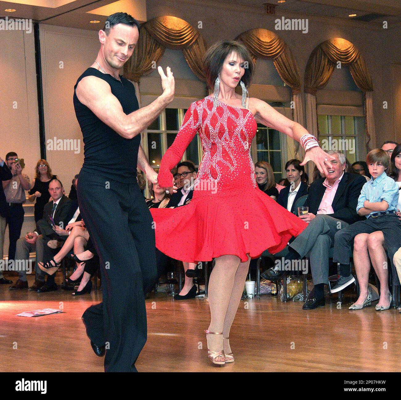 In a Saturday Feb. 25 2017 photo Jane Liebscher and her professional dance partner Alosha Anatoliy perform a Salsa routine during the Community In Schools of High Point seventh annual fundraising even...