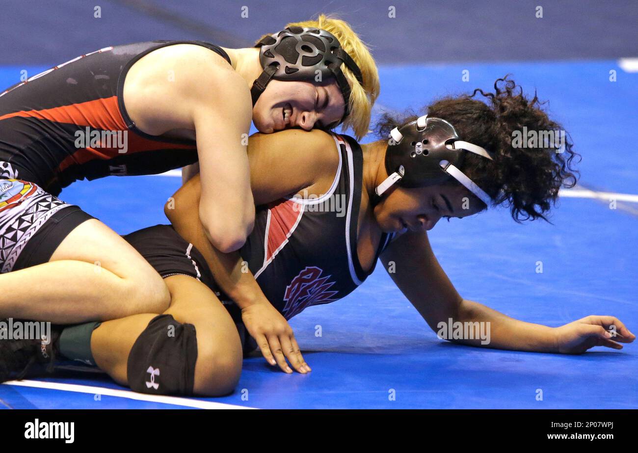 Mack Beggs, top, a transgender wrestler from Euless Trinity competes in a  quarterfinal against Mya Engert of Amarillo Tascosa during the state  wrestling tournament Friday, Feb. 24, 2017, in Cypress, Texas. Beggs