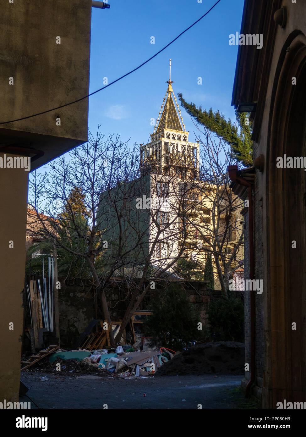 Gateway behind the attraction. Poverty and wealth. Construction debris