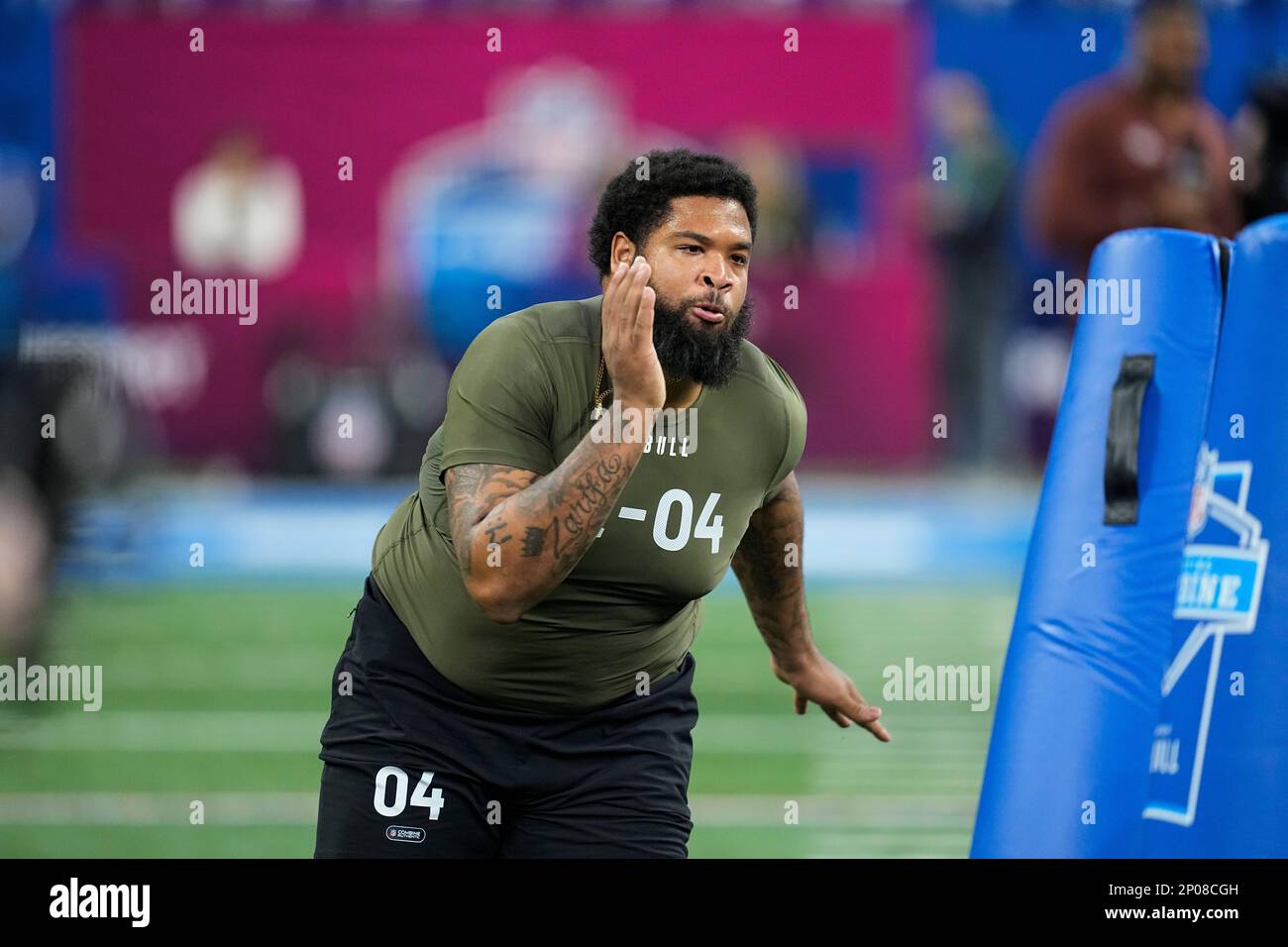 Coastal Carolina defensive lineman Jerrod Clark runs a drill at the NFL